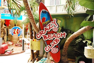 Panel &quot;Crazy Beach Club&quot; on surfboard